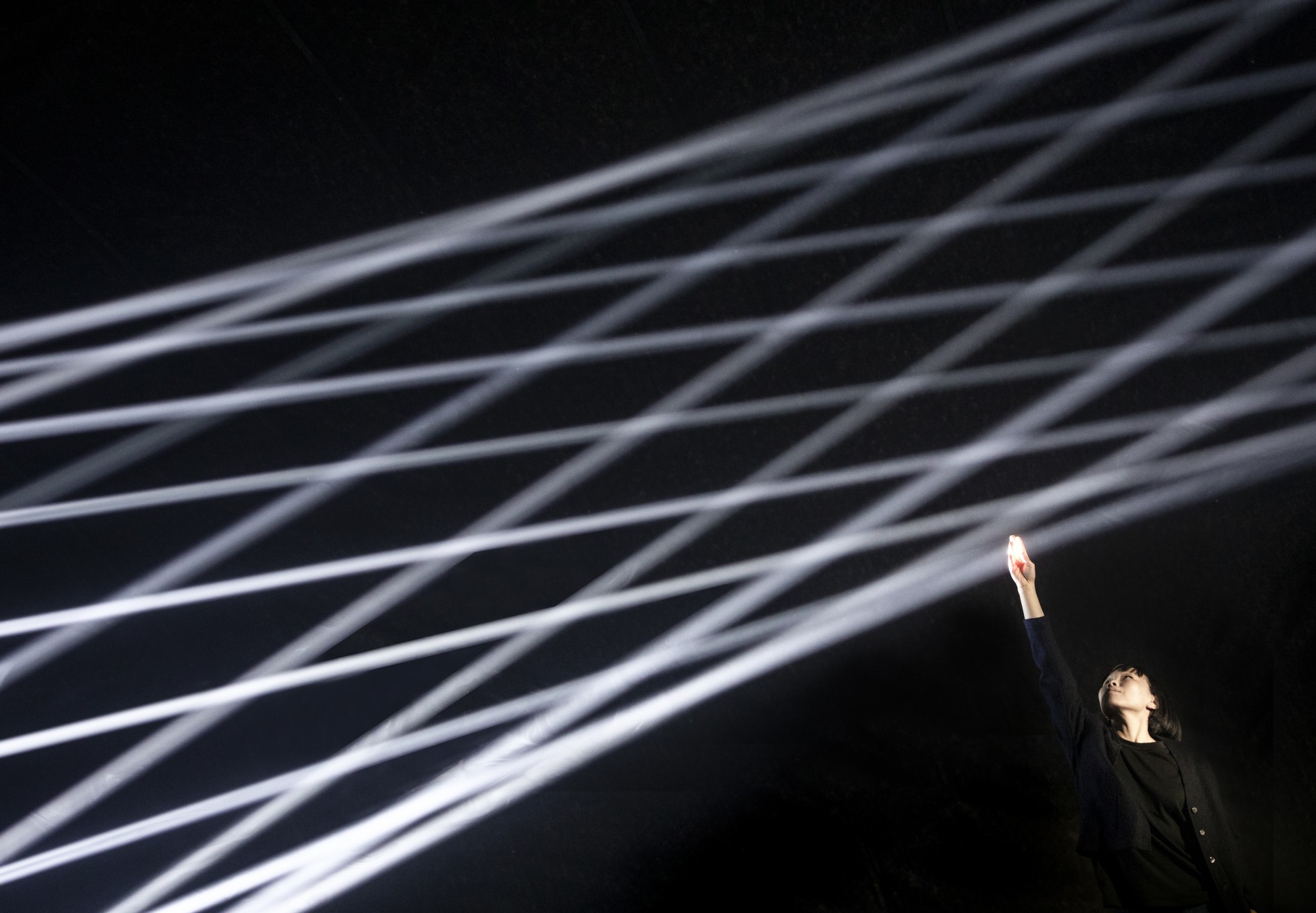 thegreeneyl licht light installation bodies in motion design week milan woman touching light signals